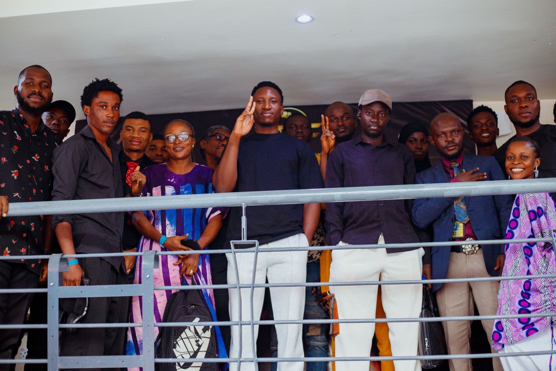 Founders and guests gathered together on the stairs at Café One Studios