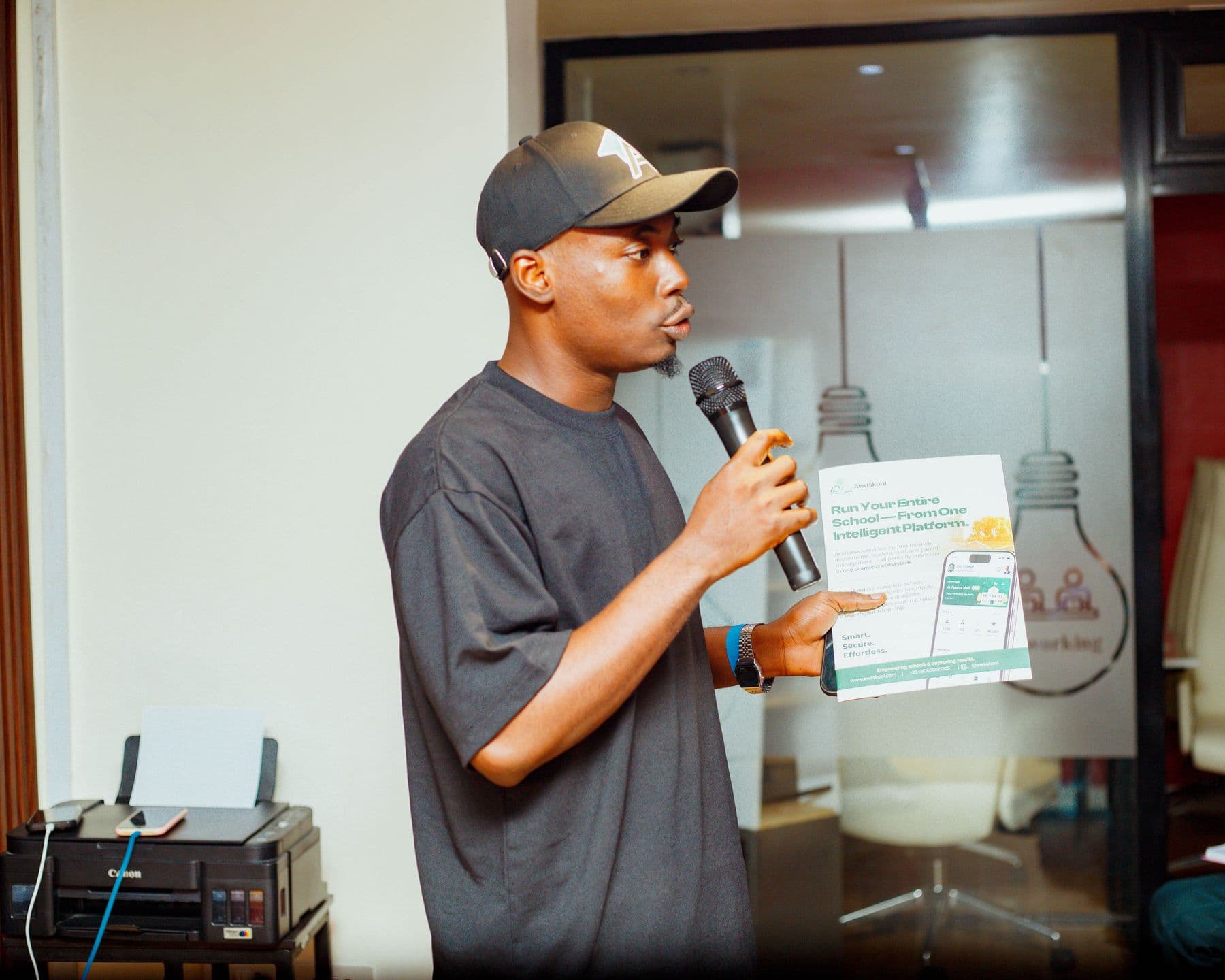 A founder pitches live, holding up his one-pager