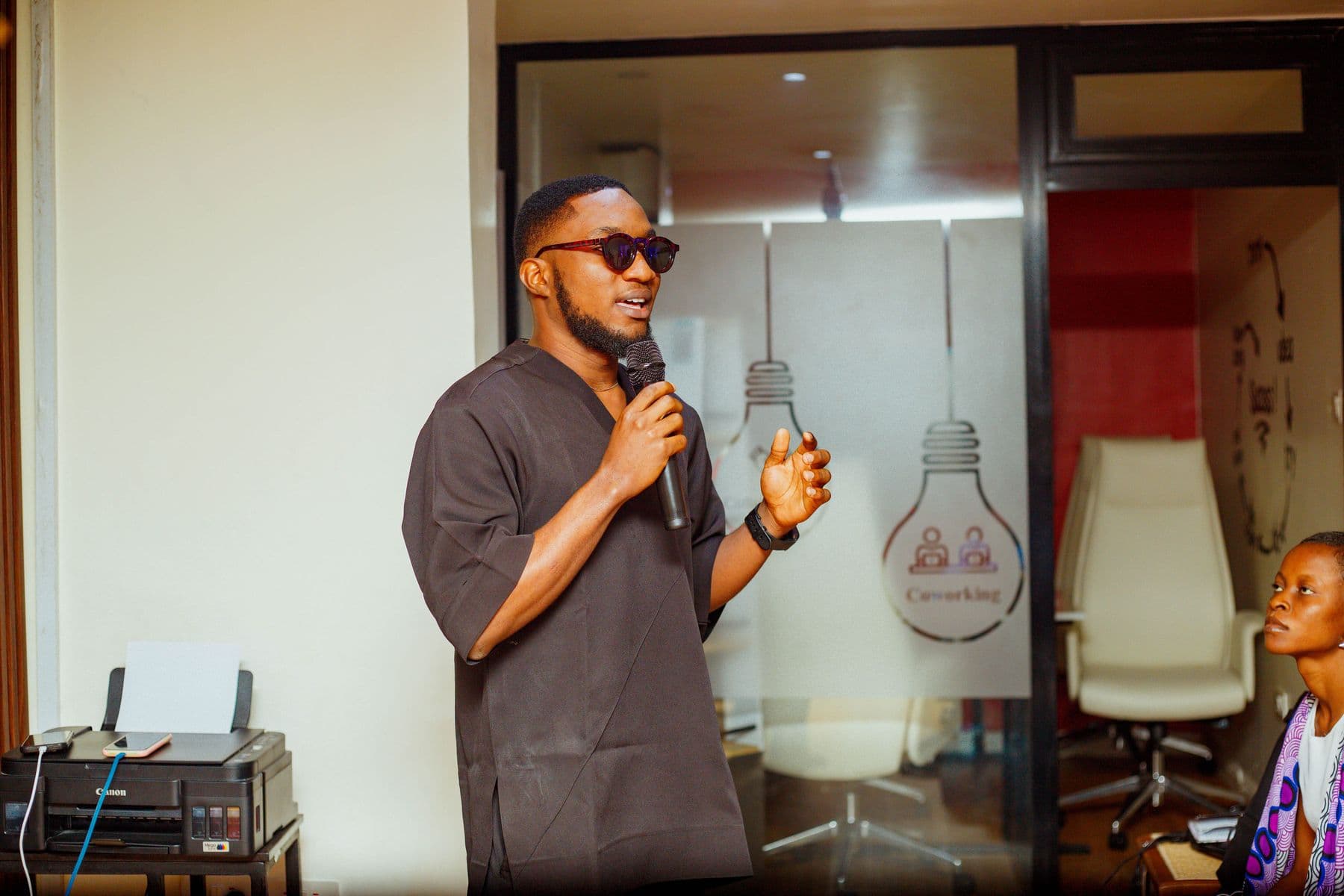 A founder in sunglasses takes the mic
