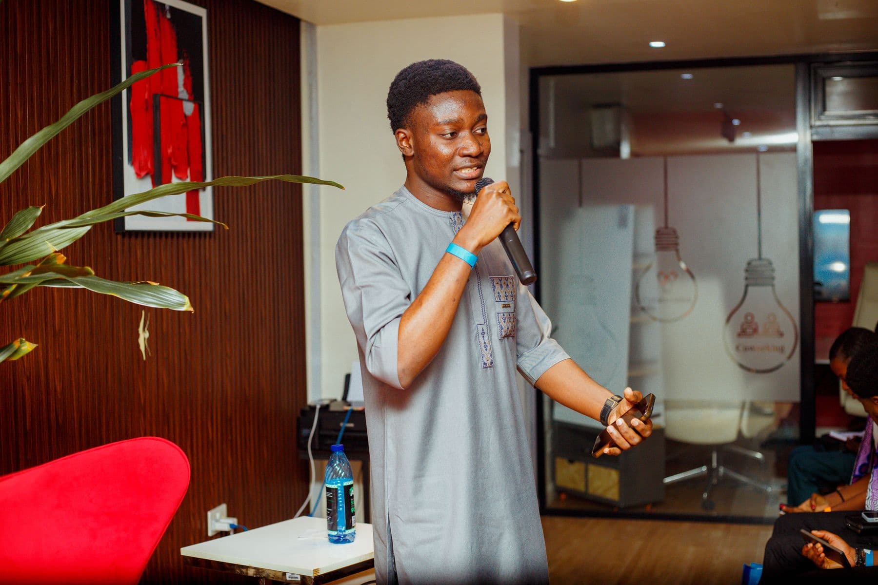 A founder in a grey kaftan shares his idea