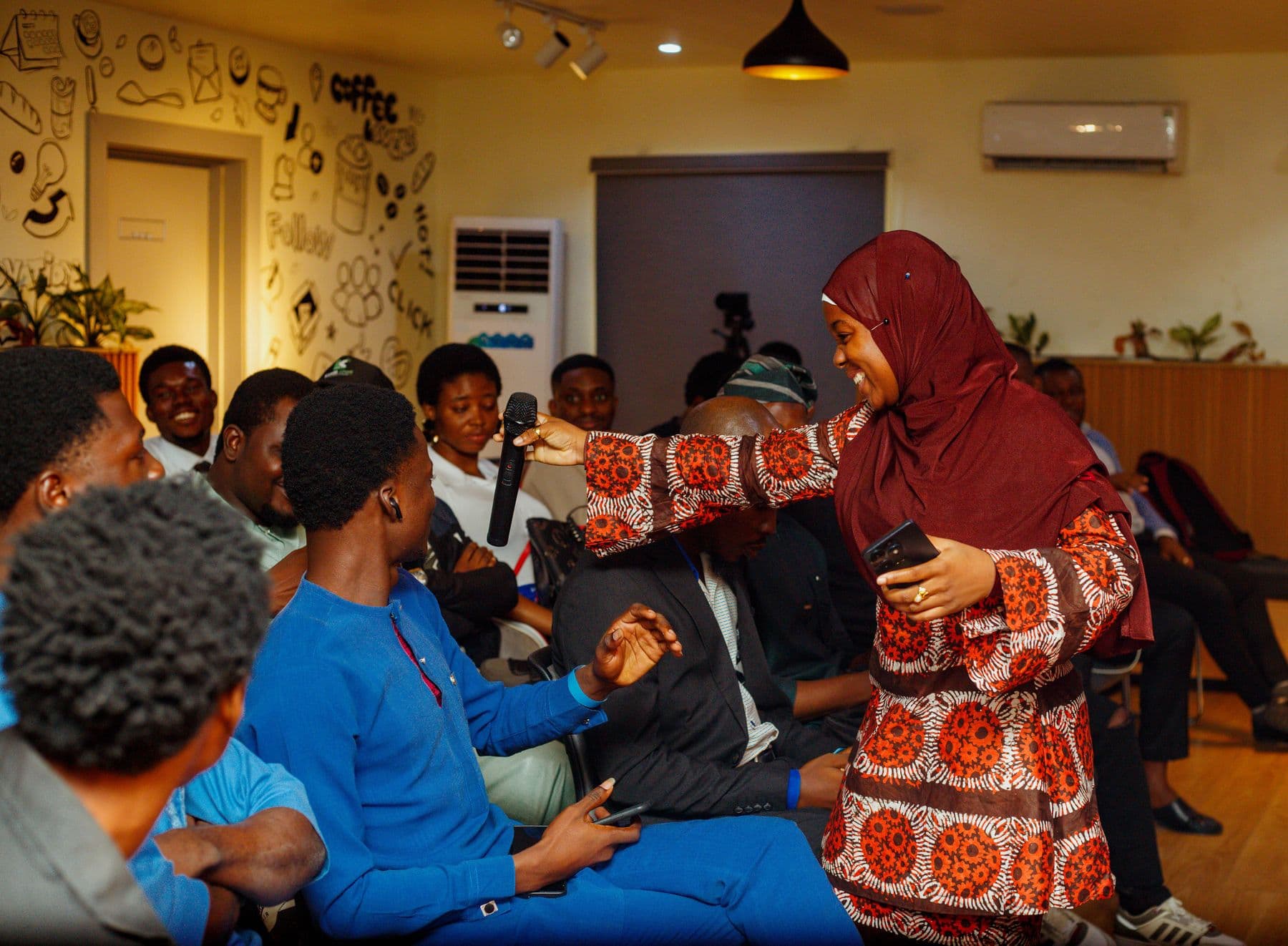 An attendee joins the conversation from the floor