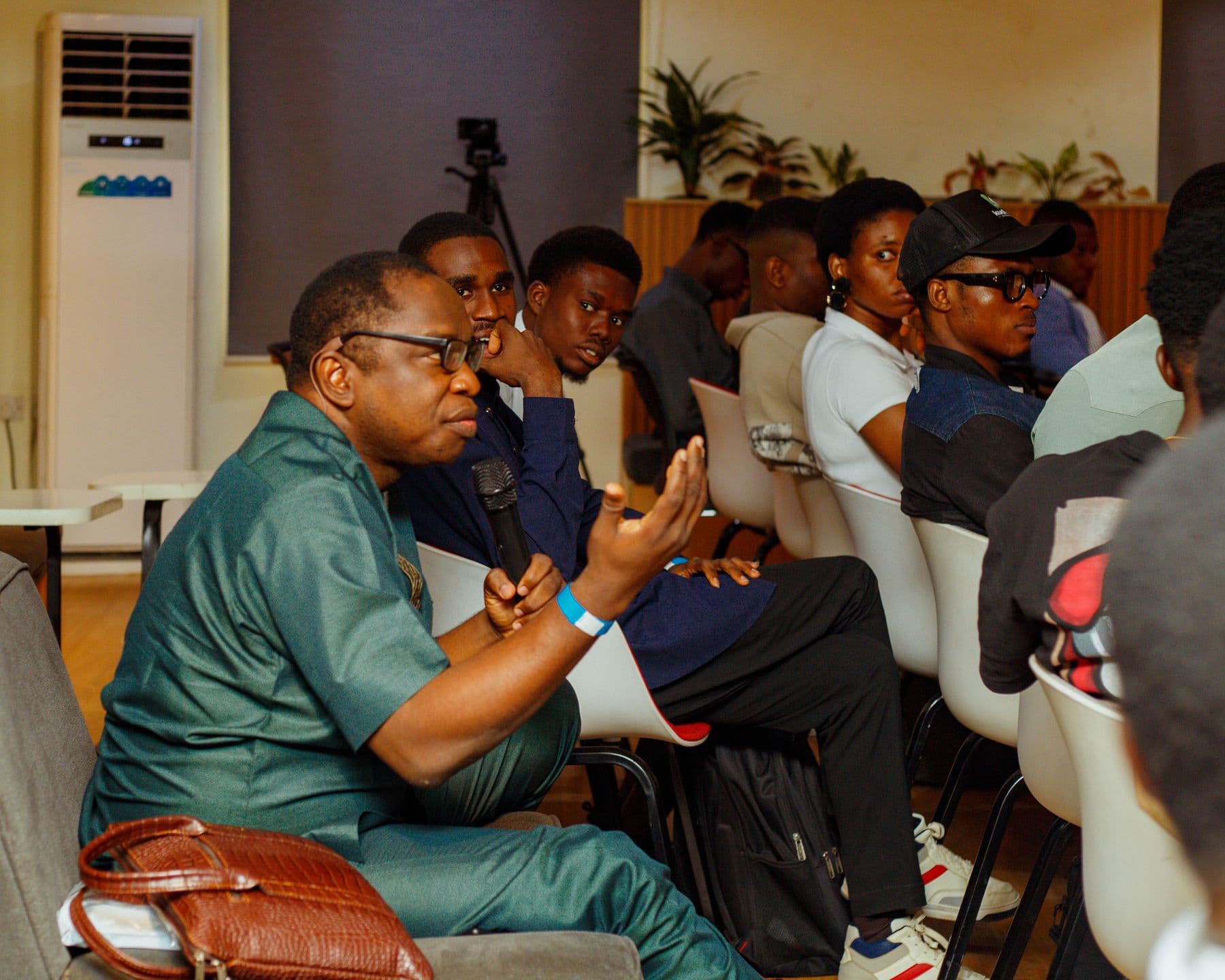 An attendee asks a question from the audience